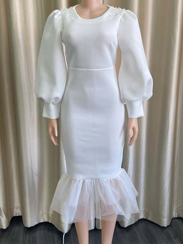 White puff sleeve dress on mannequin