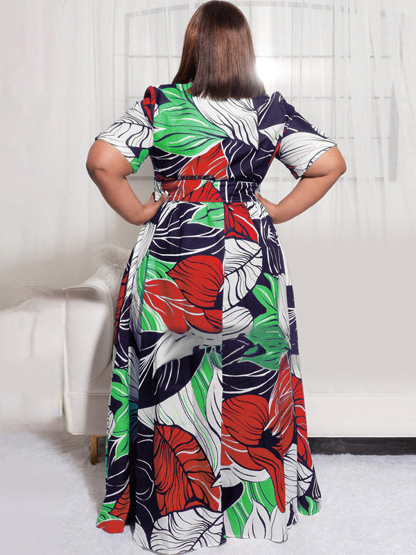 Back view of a woman wearing a floral print maxi dress with short sleeves.