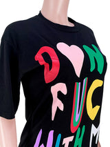 Close-up of the graphic print on a black t-shirt dress.