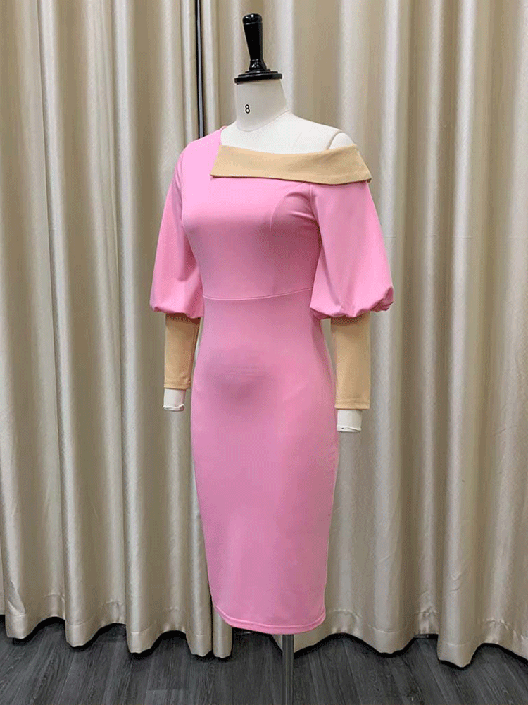 side view of pink sheath dress with asymmetrical neckline and balloon sleeves displayed on a mannequin
