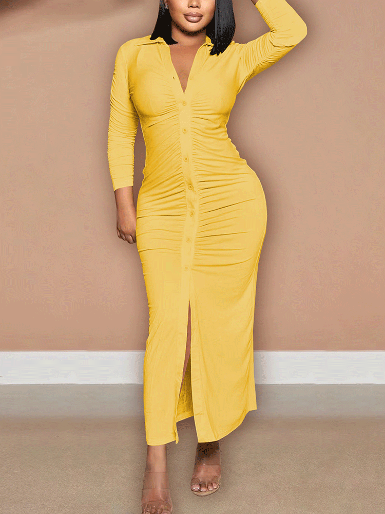 Woman wearing a yellow ruched button-down maxi dress with a high slit
