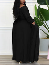 Back view of a woman wearing a black off-the-shoulder maxi dress