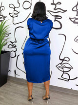 back view of a woman in a royal blue satin dress