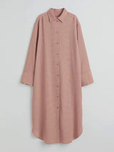 A long pink collared shirt dress laid flat, showing button-down front and textured fabric.