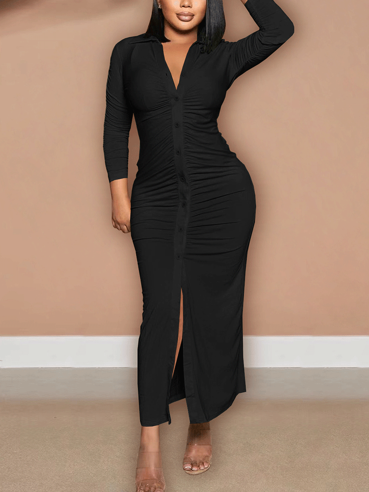 Woman wearing a black ruched button-down maxi dress with a high slit