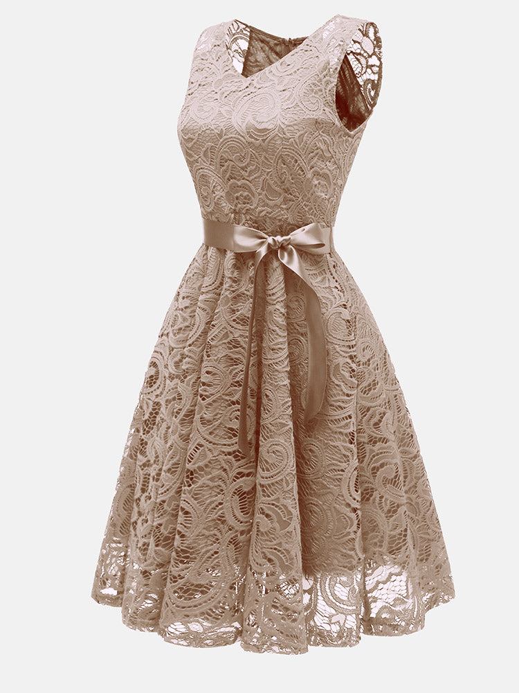 Side view of beige lace fit and flare dress with V-neck and satin ribbon