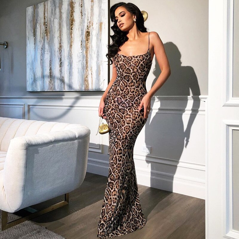 woman wearing a leopard print maxi dress with spaghetti straps
