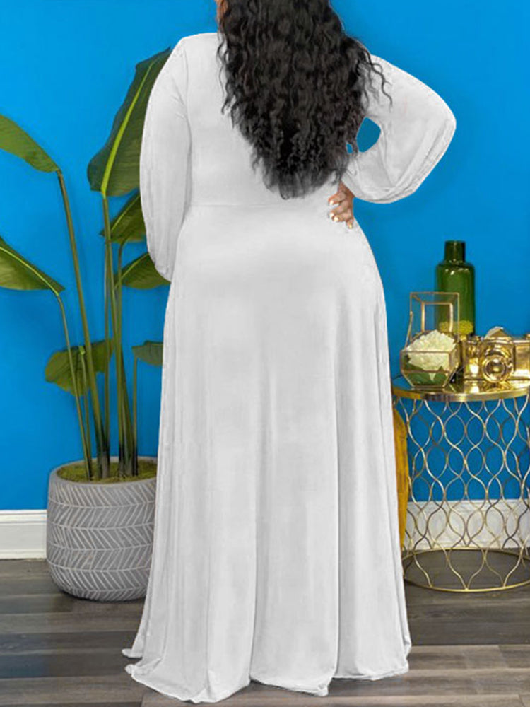 Back view of a woman wearing a white maxi dress.