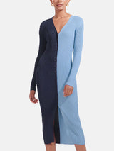 Woman wearing a navy and light blue color-block ribbed knit midi dress with a button-down front and v-neck