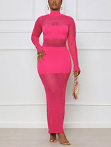 Woman wearing a bright pink bodycon maxi dress with sheer mesh panels and a mock neck, holding a clear handbag.