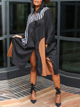 woman wearing a black and brown color block midi shirt dress with white stripes