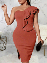 Woman wearing a rust-colored one-shoulder bodycon dress with a ruffle detail and high slit.