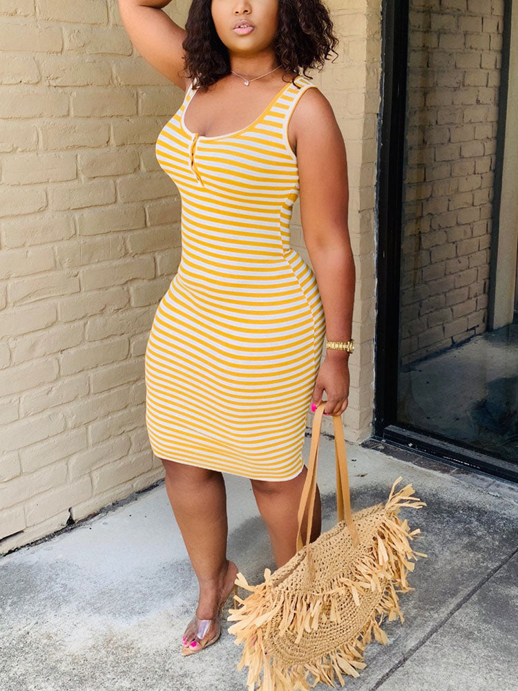 Woman wearing a yellow and white striped sleeveless dress with a scoop neckline and button detail, holding a straw bag.