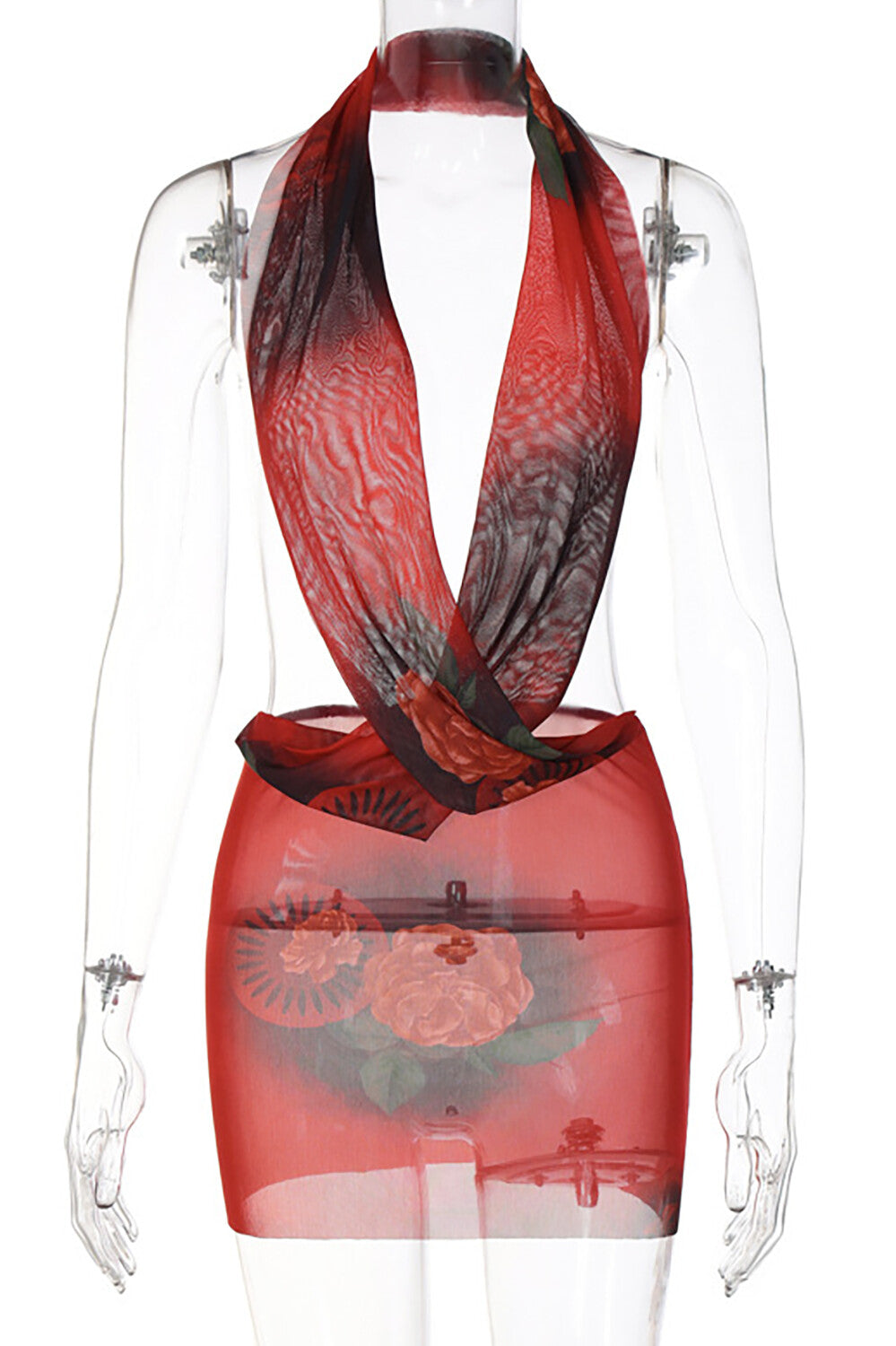Full body shot of a woman in a red sheer halter dress at night.