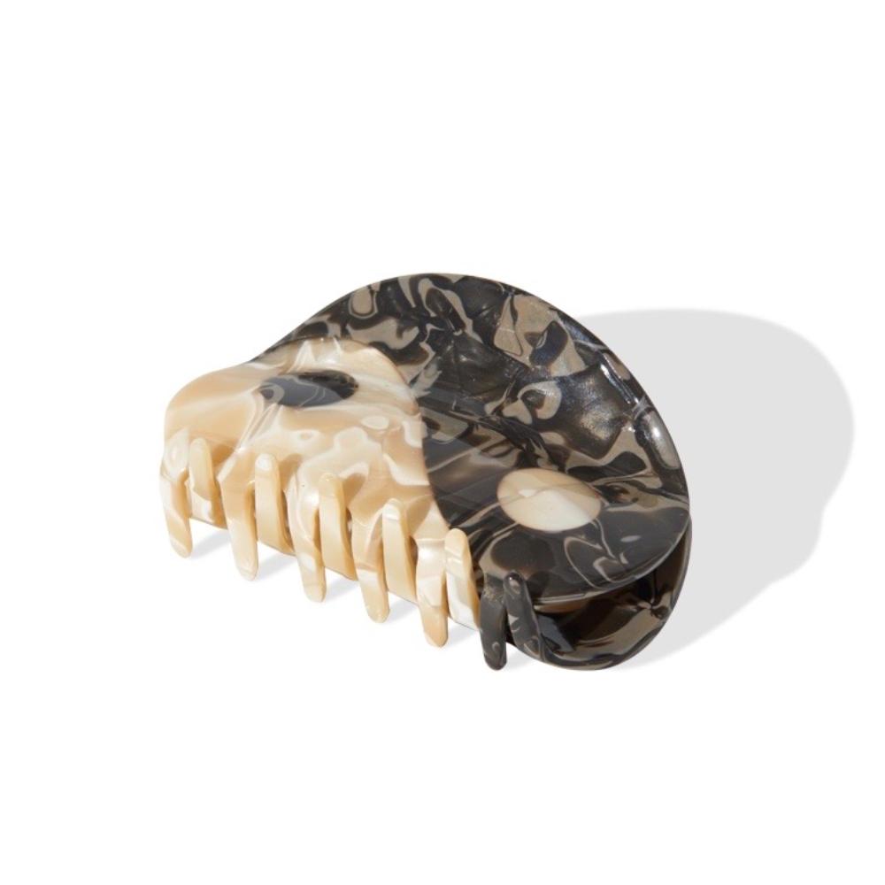 Side view of a marbled Yin Yang claw hair clip