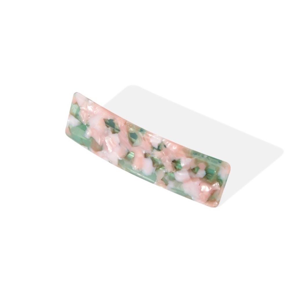Rectangular barrette with a pink and green marbled pattern, angled view.