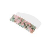 Rectangular barrette with a pink and green marbled pattern, shown from the top.