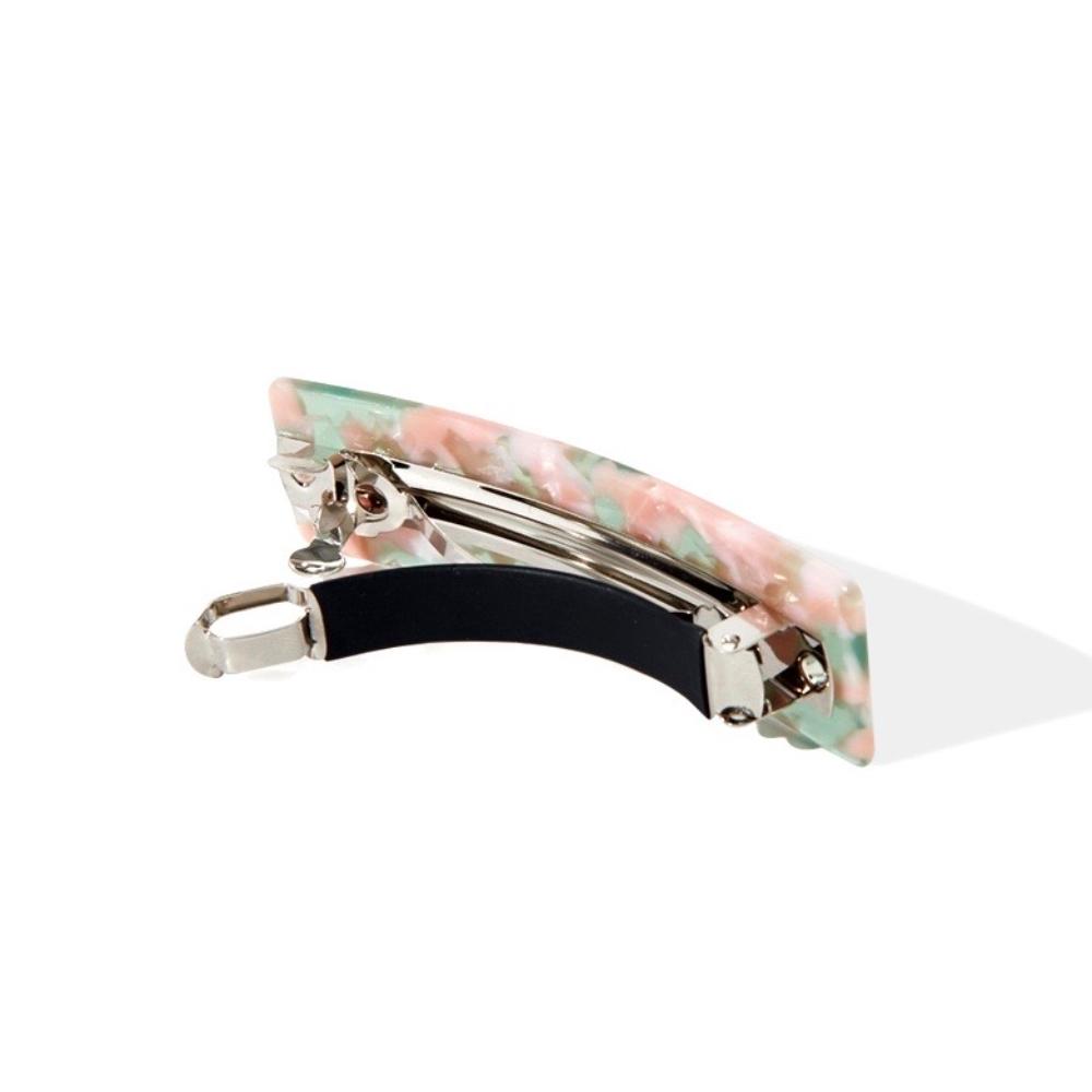 Rectangular barrette with a pink and green marbled pattern, shown from the side, revealing the metal clip mechanism.