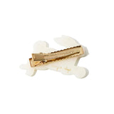 Back view of white resin bunny hair clip with gold alligator clip