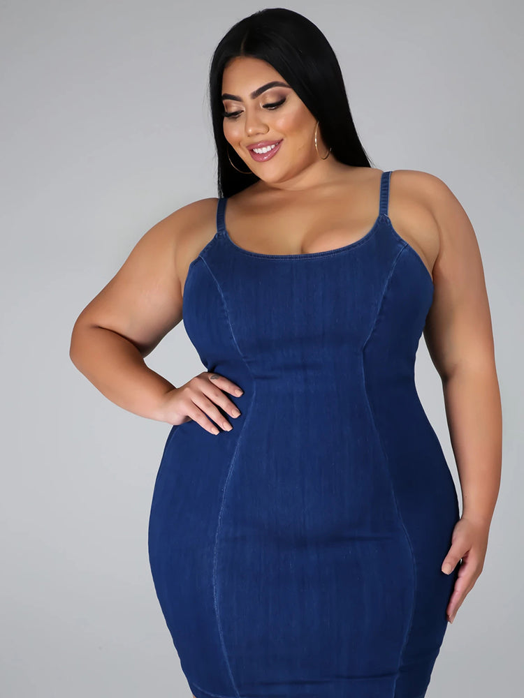 Close-up of a woman's upper body in a denim sheath dress.