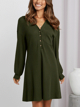 Side view of a woman in an olive green waffle knit shirt dress