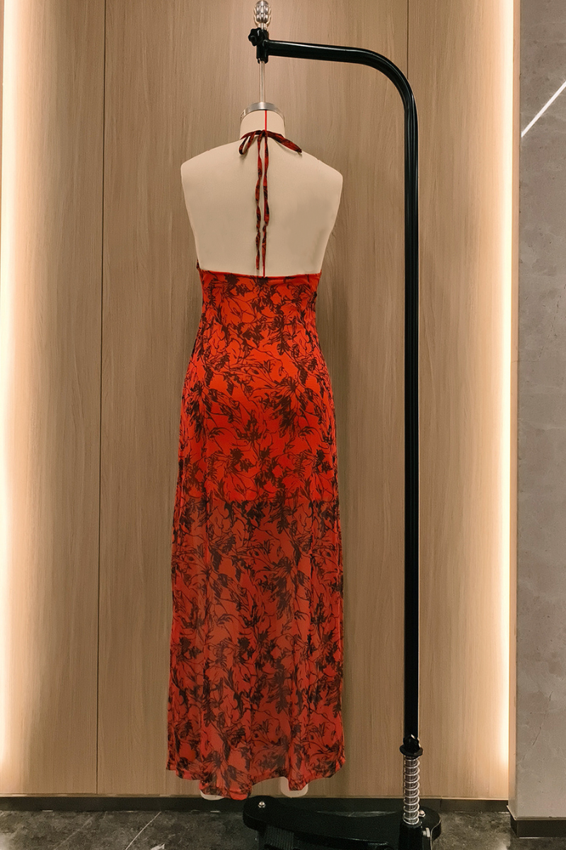 back view of an orange floral print maxi dress on a mannequin