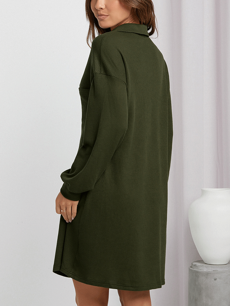 Back view of a woman in an olive green waffle knit shirt dress