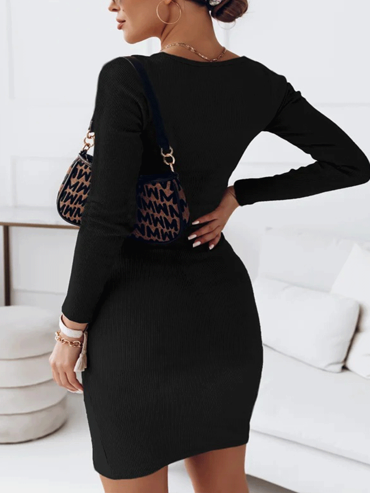 Back view of a woman wearing a black long-sleeved bodycon dress with a cut-out neckline.
