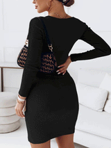 Back view of a woman wearing a black long-sleeved bodycon dress with a cut-out neckline.