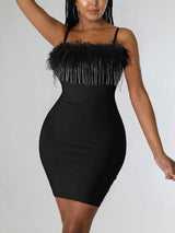 Back view of a woman in a black bodycon dress with a zipper closure