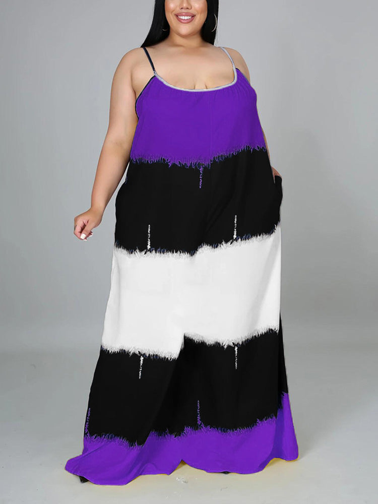 Woman wearing a purple, black, and white tie-dye maxi dress with spaghetti straps and pockets, front view.