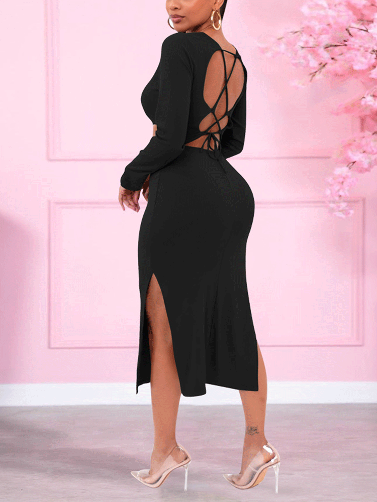Back view of a woman wearing a long-sleeved black midi dress with cut-out details, side slit, and lace-up back.