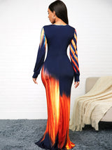 Back view of a woman in a long, fitted dress with an abstract print.