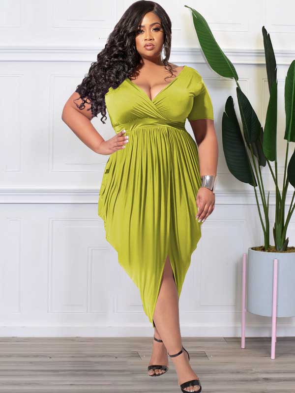 Back view of a plus-size model wearing a lime green ruched V-neck short-sleeve dress with a tulip hem.