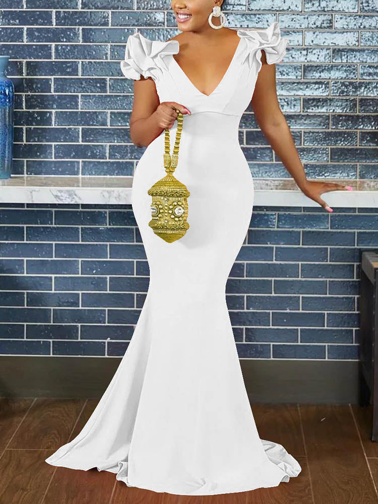Woman wearing a white mermaid-style formal gown with ruffled cap sleeves and a deep V-neckline.