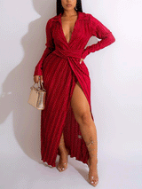 Back view of a woman in a red pleated maxi dress.