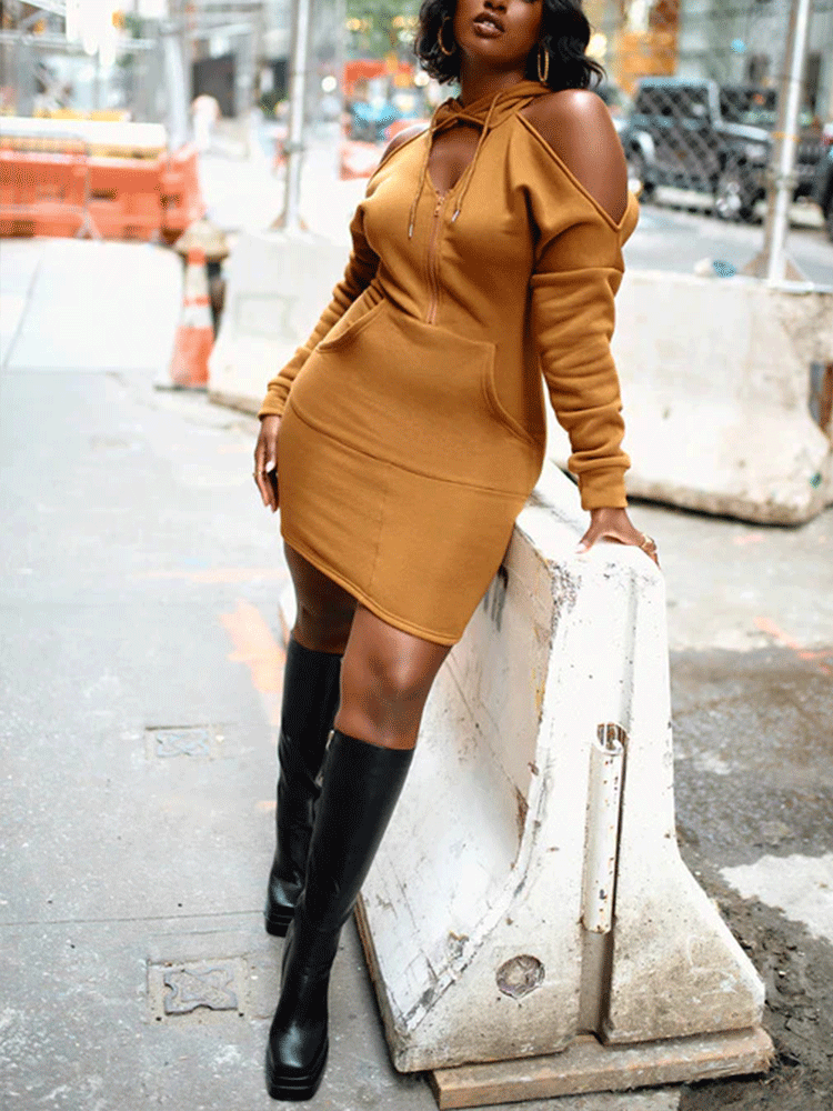 detail of the fabric and fit of a brown hooded dress