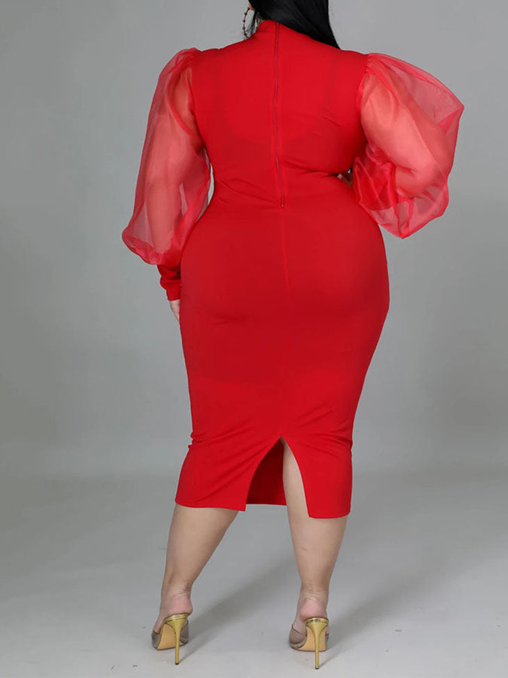 Plus-size woman wearing a red mock neck sheath dress with sheer puff sleeves and a slit hem, back view
