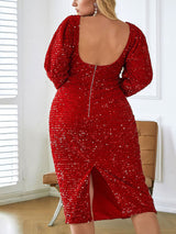 Back view of a woman in a red sequined midi dress, showing the zipper closure and slit hem.