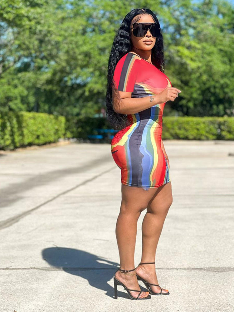 Side view of a woman in an abstract print bodycon mini dress.