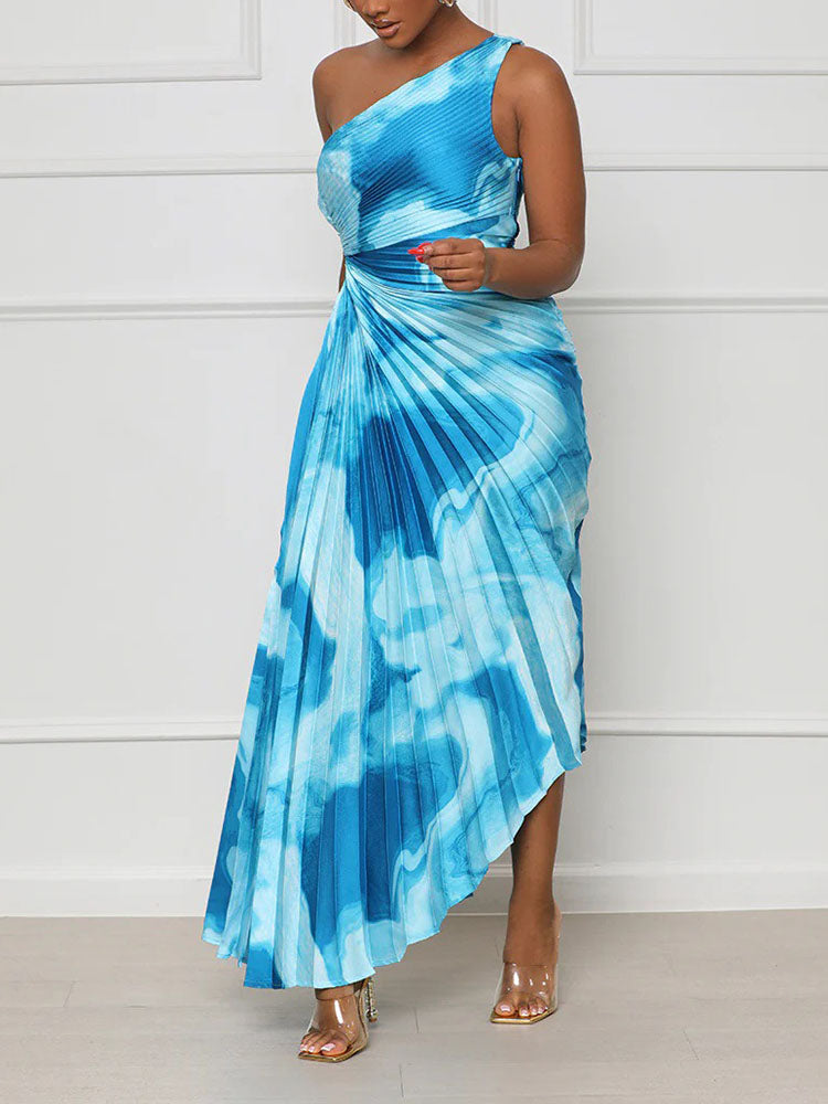 Woman wearing a blue tie-dye one-shoulder pleated maxi dress from the front.