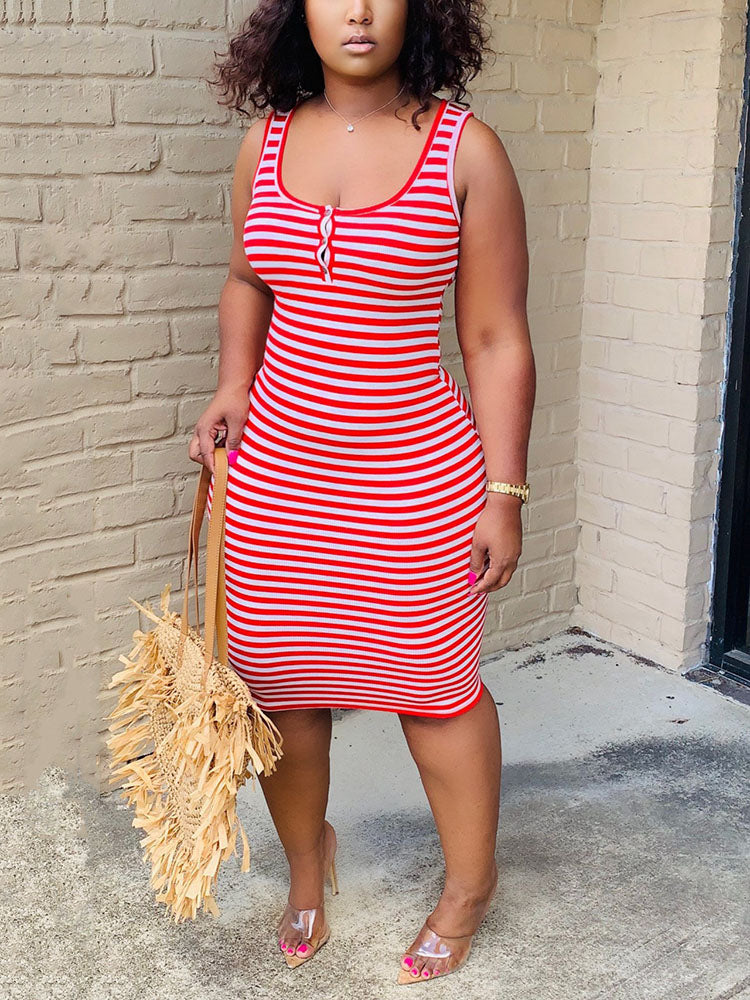 Woman wearing a red and white striped sleeveless dress with a scoop neckline and button detail, holding a straw bag.