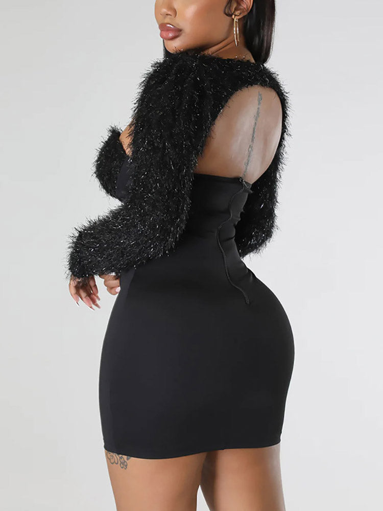 Rear view of a woman in a black bodycon dress with a sweetheart neckline and fuzzy trim, showing a zipper closure.