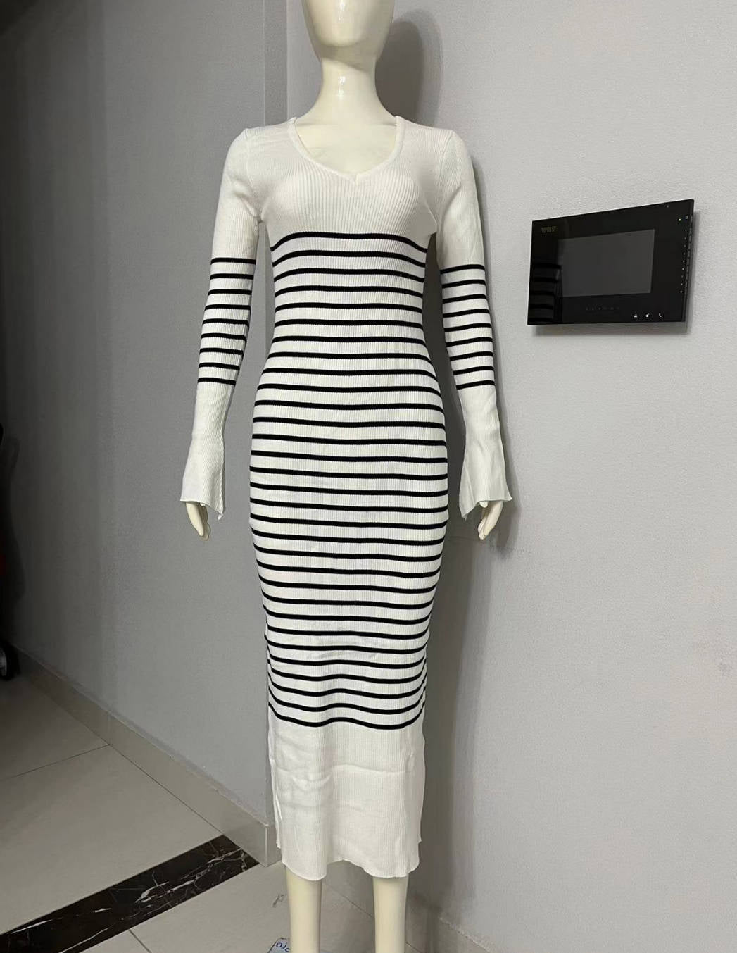 Striped maxi dress displayed on a mannequin