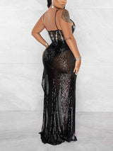 Back view of a black sequined maxi dress with a sheer overlay.