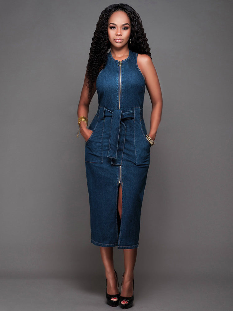 woman wearing a sleeveless denim sheath dress with a zipper front and belted waist