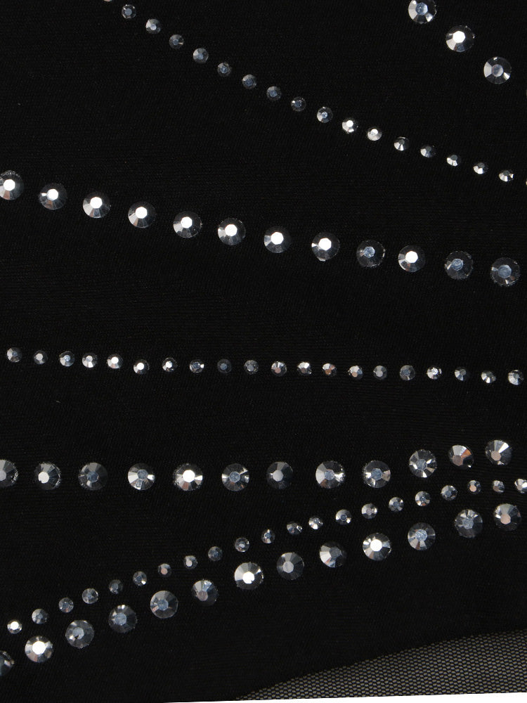 Close-up of black fabric with a mesh insert and decorative rhinestone detailing.