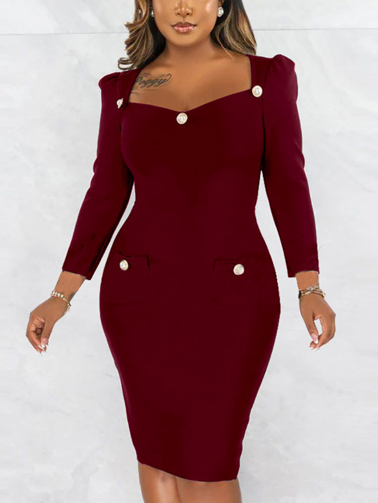 woman wearing a burgundy sheath dress with long sleeves and button details
