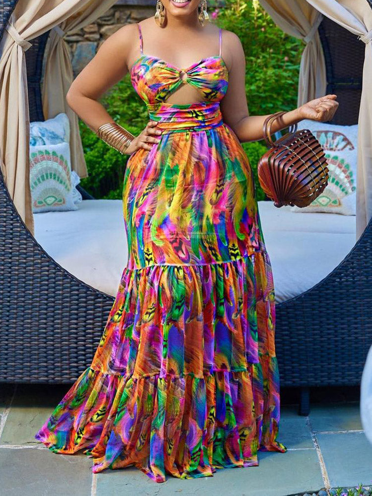 Woman wearing a colorful abstract print maxi dress with a cut-out waist and tiered skirt