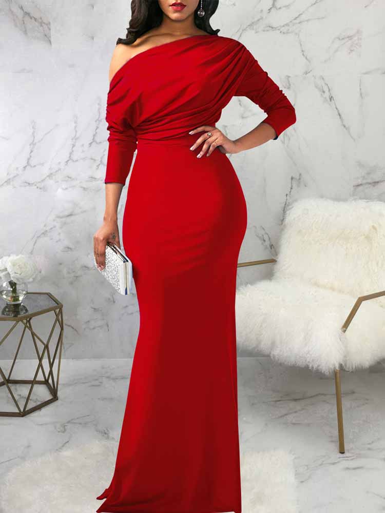 woman wearing a red one-shoulder draped long sleeve mermaid formal gown